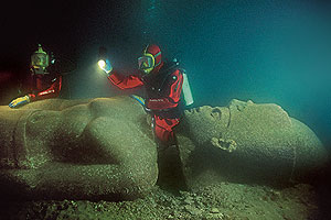 Divers and submerged statue