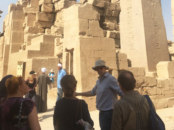 BSS students gather with Bill Manley beneath Hatshepsut's obelisk at Karnak, to read the inscription they had prepared in classes back at the hotel that week
